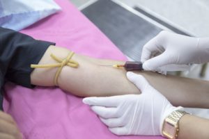 a physician injecting medicine